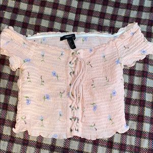 A pink crop top with green flowers from Forever 21